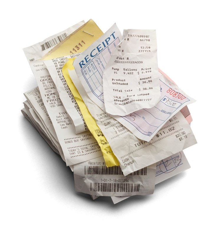 A messy pile of paper receipts — what Paperless replaces
